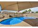 Refreshing pool in a private backyard oasis with desert landscaping at 1414 W Alder Rd, Queen Creek, AZ 85140