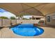 Backyard pool with desert landscaping for a refreshing experience at 1414 W Alder Rd, Queen Creek, AZ 85140