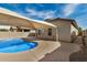 Charming pool featuring a sunshade and desert landscaping at 1414 W Alder Rd, Queen Creek, AZ 85140