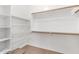 Spacious walk-in closet with built-in shelving and ample storage space at 1414 W Alder Rd, Queen Creek, AZ 85140