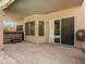This back patio features a spa, many windows, and an entry way to the pool at 14317 N 78Th Dr, Peoria, AZ 85381