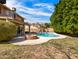 Yard showcasing the pool, fire pit, patio, and mature trees, offering a serene and private outdoor retreat at 14317 N 78Th Dr, Peoria, AZ 85381