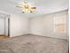 Bedroom with carpet flooring, a ceiling fan, and natural light at 14317 N 78Th Dr, Peoria, AZ 85381