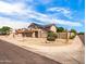 Charming home featuring solar panels, xeriscaping, and a convenient three-car garage at 14317 N 78Th Dr, Peoria, AZ 85381