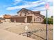 Well-maintained two-story home with xeriscaping and a three-car garage, located in a quiet neighborhood at 14317 N 78Th Dr, Peoria, AZ 85381