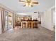 Spacious living room with bar seating and access to the backyard at 14317 N 78Th Dr, Peoria, AZ 85381