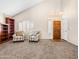 Bright living room featuring a decorative light fixture, furniture, and neutral tones at 14317 N 78Th Dr, Peoria, AZ 85381
