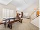 Spacious living room with a table, bookcases, and neutral tones at 14317 N 78Th Dr, Peoria, AZ 85381