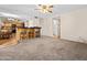 Open floor plan with bar seating and view to the kitchen and an adjacent living area at 14317 N 78Th Dr, Peoria, AZ 85381