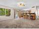 Spacious living room with bar seating and views to backyard and pool at 14317 N 78Th Dr, Peoria, AZ 85381