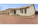Backyard view with covered patio and low-maintenance landscaping at 14527 W Marcus Dr, Surprise, AZ 85374