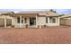 Backyard view with covered patio and low-maintenance landscaping at 14527 W Marcus Dr, Surprise, AZ 85374