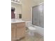 Bright bathroom with tile flooring, modern vanity, toilet and shower/tub combo at 14527 W Marcus Dr, Surprise, AZ 85374