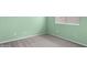 Comfortable bedroom with new carpeting, light green paint, and a bright window at 14527 W Marcus Dr, Surprise, AZ 85374