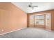 Cozy bedroom with plush carpet, neutral paint and a bright bay window at 14527 W Marcus Dr, Surprise, AZ 85374