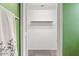 Bright closet with built-in shelf, rod, and neutral carpeting at 14527 W Marcus Dr, Surprise, AZ 85374