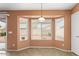 Dining area featuring a bay window that fills the space with natural light at 14527 W Marcus Dr, Surprise, AZ 85374