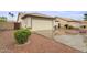 Well-maintained single-Gathering home with a lush green lawn and driveway at 14527 W Marcus Dr, Surprise, AZ 85374