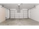 Spacious two car garage with a door at 14527 W Marcus Dr, Surprise, AZ 85374