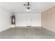 Spacious two car garage with water heater and shelving units at 14527 W Marcus Dr, Surprise, AZ 85374