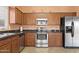 Updated kitchen featuring stainless steel appliances and sleek countertops at 14527 W Marcus Dr, Surprise, AZ 85374