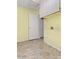 Bright laundry room with overhead cabinets and a tiled floor at 14527 W Marcus Dr, Surprise, AZ 85374