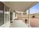 Covered patio view with pavers and low-maintenance landscaping at 14527 W Marcus Dr, Surprise, AZ 85374