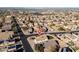 Property aerial view showcasing location within a vibrant community with nearby shopping and solar panels at 14717 N 130Th Ln, El Mirage, AZ 85335