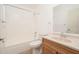 Bathroom featuring updated vanity, shower-tub combo, and updated fixtures at 14717 N 130Th Ln, El Mirage, AZ 85335
