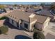 Exterior aerial view showcasing a well-maintained home with desert landscaping and a two-car garage at 14717 N 130Th Ln, El Mirage, AZ 85335