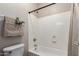 Bathroom featuring a combination shower and bathtub, white walls and white shower surround at 15239 W Alexandria Way, Surprise, AZ 85379