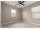 Neutral bedroom featuring carpeting, baseboards, ceiling fan, and windows with blinds, with neutral paint on the walls at 15239 W Alexandria Way, Surprise, AZ 85379