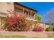 Charming home with a cozy balcony adorned with vibrant bougainvillea, adding a touch of elegance and color at 15239 W Alexandria Way, Surprise, AZ 85379