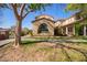 Beautiful home with a unique arched window and well-maintained lawn, creating an inviting curb appeal at 15239 W Alexandria Way, Surprise, AZ 85379