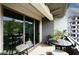 Balcony includes lounge area with furniture and views of lush foliage at 15802 N 71St St # 501, Scottsdale, AZ 85254