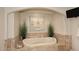 Elegant bathtub with decorative tile surround, set in a cozy alcove at 15802 N 71St St # 501, Scottsdale, AZ 85254