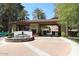 Gated community entrance with lush landscaping and a decorative fountain at 15802 N 71St St # 501, Scottsdale, AZ 85254