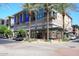 Modern building featuring retail space and apartments with palm trees at 15802 N 71St St # 501, Scottsdale, AZ 85254