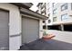 Attached one car garage with grey door and concrete driveway in well maintained complex at 15802 N 71St St # 501, Scottsdale, AZ 85254