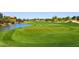 Beautiful golf course with green grass and a pond at 15802 N 71St St # 501, Scottsdale, AZ 85254