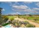 Scenic golf course view with lush green fairways and desert landscape on a sunny, partly cloudy day at 15802 N 71St St # 501, Scottsdale, AZ 85254