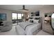 Spacious main bedroom with stylish decor, ceiling fan, and private balcony access at 15802 N 71St St # 501, Scottsdale, AZ 85254