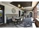 Outdoor community lounge with comfortable seating, decorative lighting, and a stylish patterned floor at 15802 N 71St St # 501, Scottsdale, AZ 85254