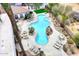 Stunning aerial view of the community pool featuring a hot tub, poolside seating, and beautiful desert landscaping at 15802 N 71St St # 501, Scottsdale, AZ 85254