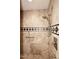 Walk-in shower boasting neutral tile and modern shower fixtures at 15802 N 71St St # 501, Scottsdale, AZ 85254