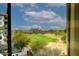 Expansive view of the community golf course and surrounding landscape from a window at 15802 N 71St St # 501, Scottsdale, AZ 85254