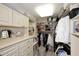 Spacious walk-in closet with custom shelves, drawers, and ample storage space at 15802 N 71St St # 501, Scottsdale, AZ 85254