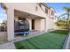 Charming backyard with an artificial lawn, patio, and ample space for outdoor activities and relaxation at 1708 W Seagull Ct, Chandler, AZ 85286