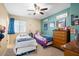 Bright bedroom with two beds, a dresser, and a cozy carpeted floor at 1708 W Seagull Ct, Chandler, AZ 85286