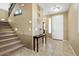 Inviting foyer with tiled floor, staircase, and decorative accents at 1708 W Seagull Ct, Chandler, AZ 85286